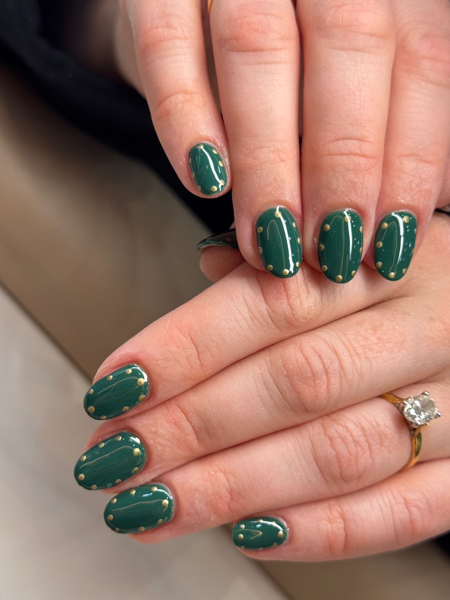 Emerald green nails with gold polka dots by Sibs Nails