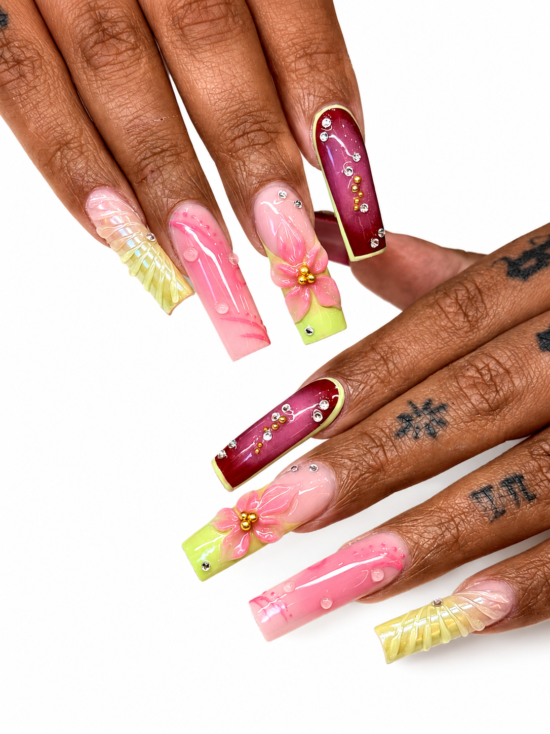 Long coffin nails with 3D pink floral sculpture, red and pearl finishes